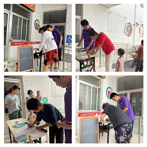 社工引导村民签到以及领取号码牌_副本.jpg